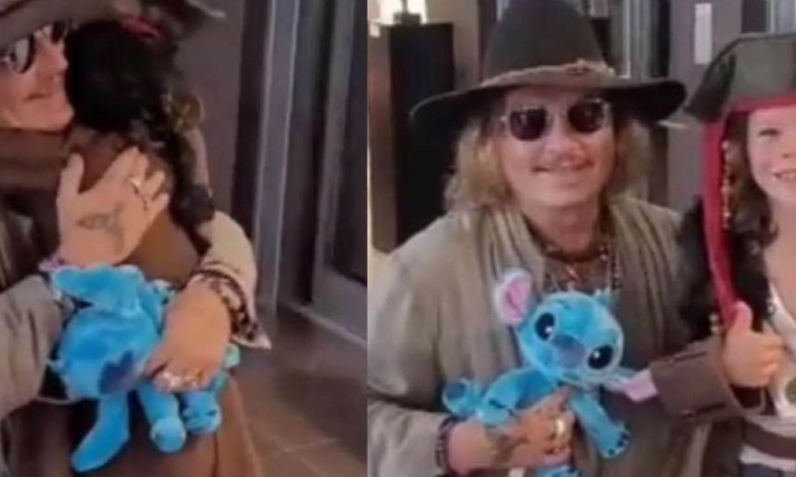Johnny Depp Menggendong Penggemar Cilik yang Berpakaian ALa Kapten Jack Sparrow